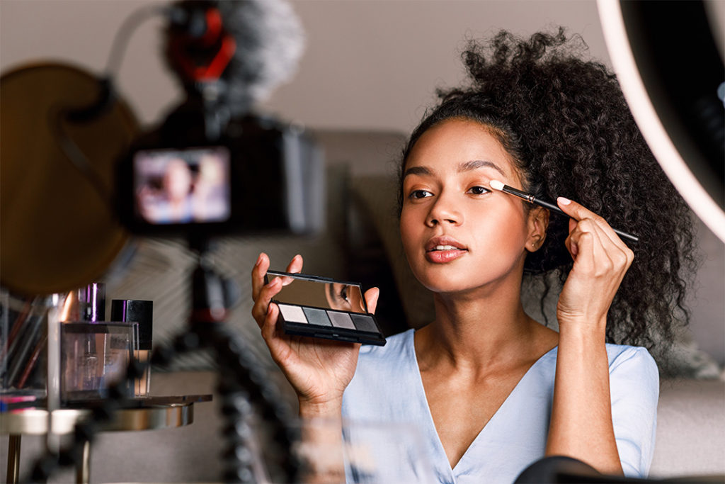 Beauty Video Blogger Applying Makeup on Camera